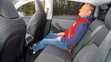 New Tesla Model Y Standard - rear seats being sat in by Holger Preiss from Auto Bild