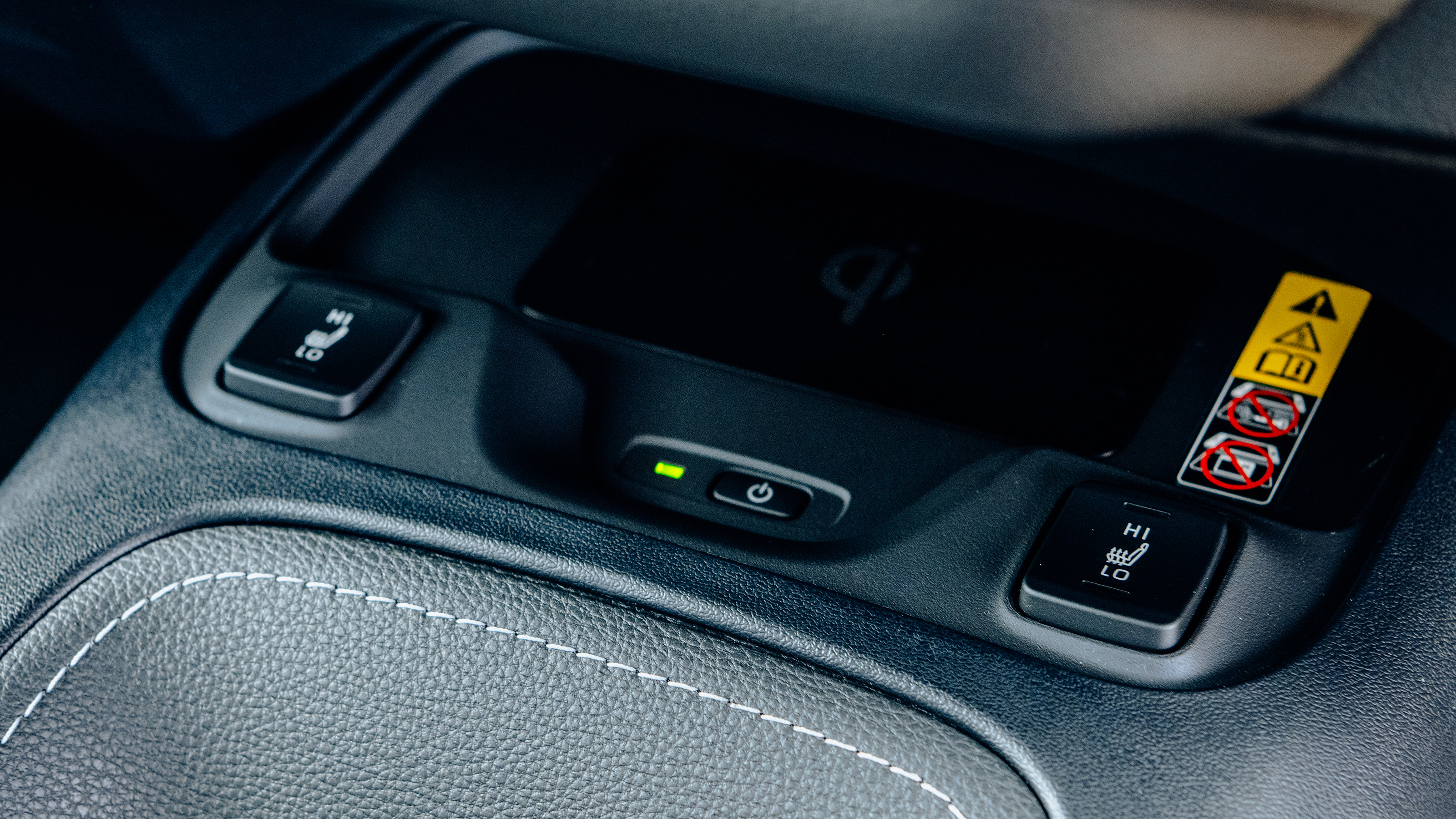 Toyota Corolla Excel in the UK - centre console, heated seats and wireless phone charging pad