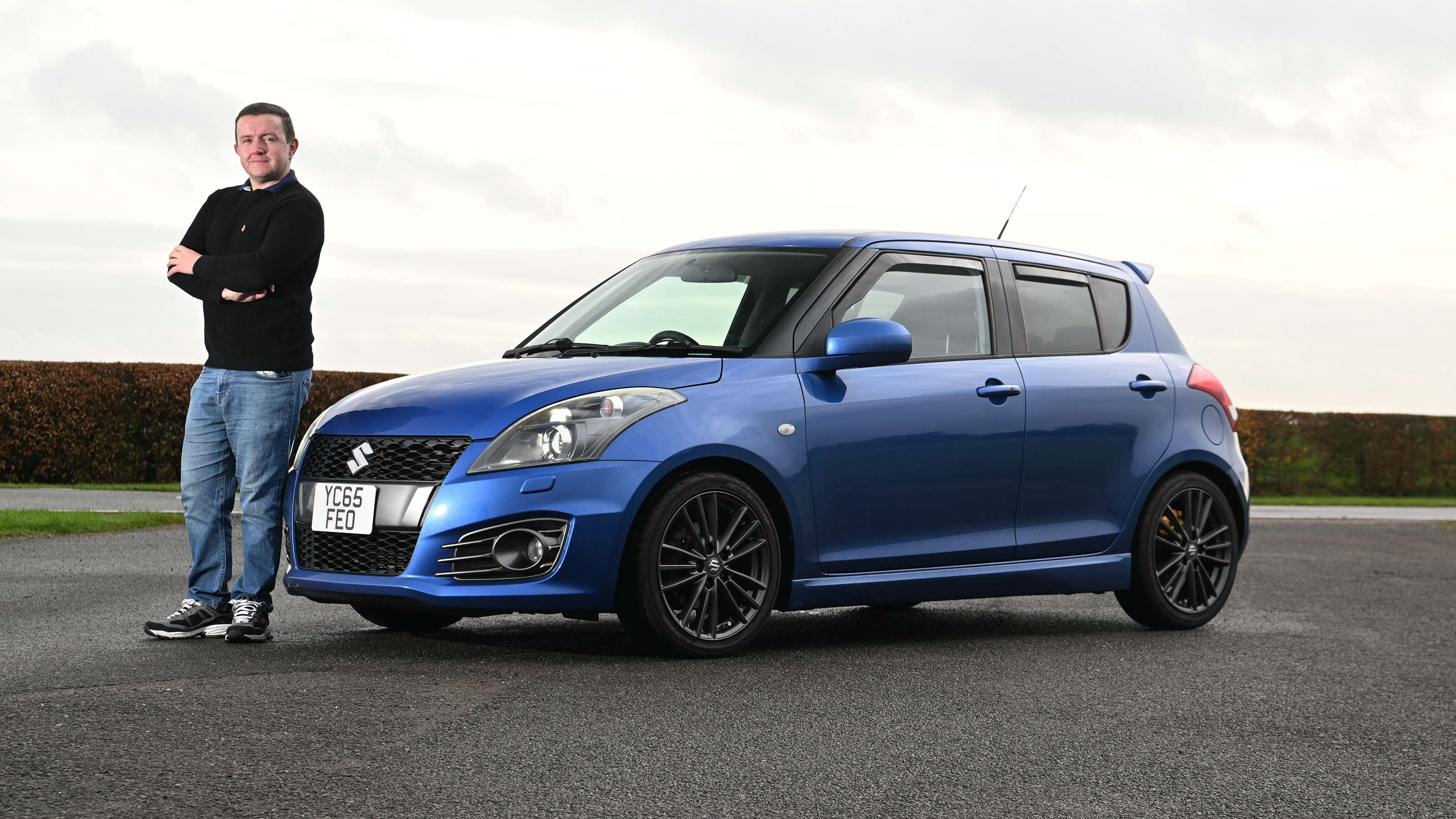 Auto Express senior content editor Shane Wilkinson and his Suzuki Swift Sport