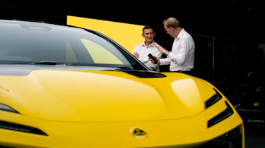 Aulto Express editor-at-large Phil McNamara standing next to a Lotus Emeya