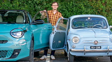 Auto Express consumer reporter Tom Jervis standing between a classic and modern Fiat 600