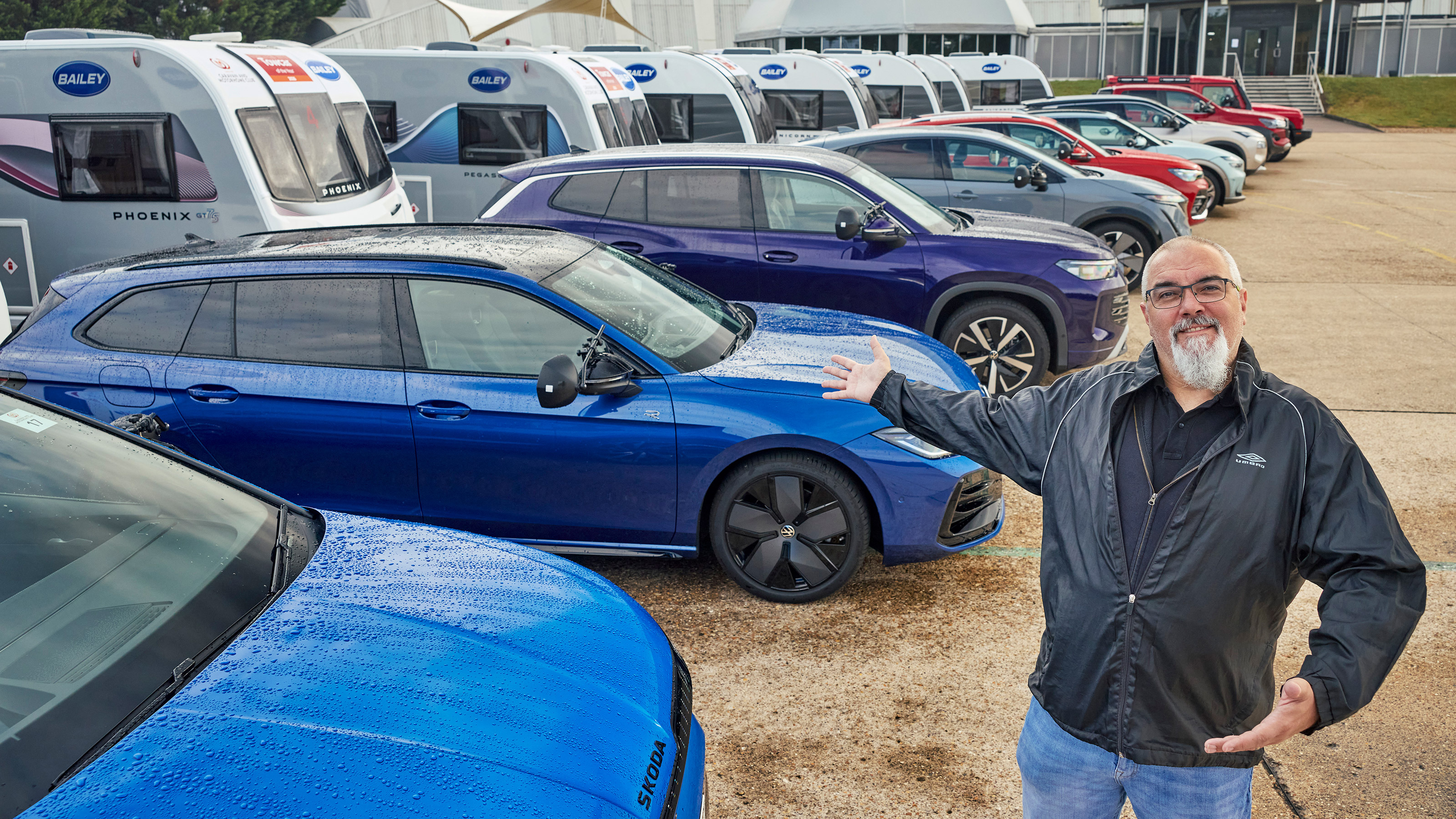 Auto Express senior road test editor Dean Gibson stood next to a selection of towing cars
