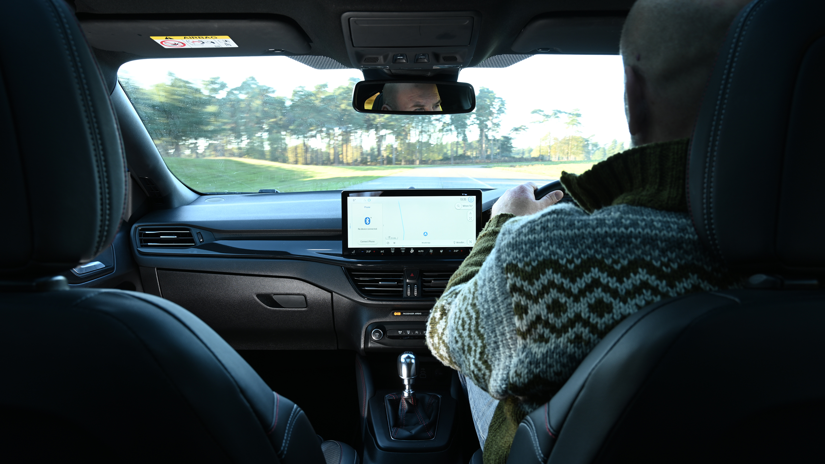 Auto Express creative director Darren Wilson driving a Ford Focus