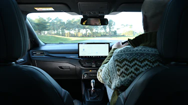 Auto Express creative director Darren Wilson driving a Ford Focus