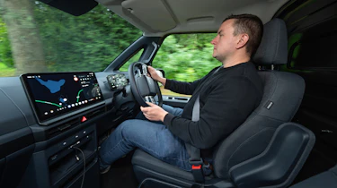 Auto Express senior content editor Shane Wilkinson driving the Kia PV5 Cargo