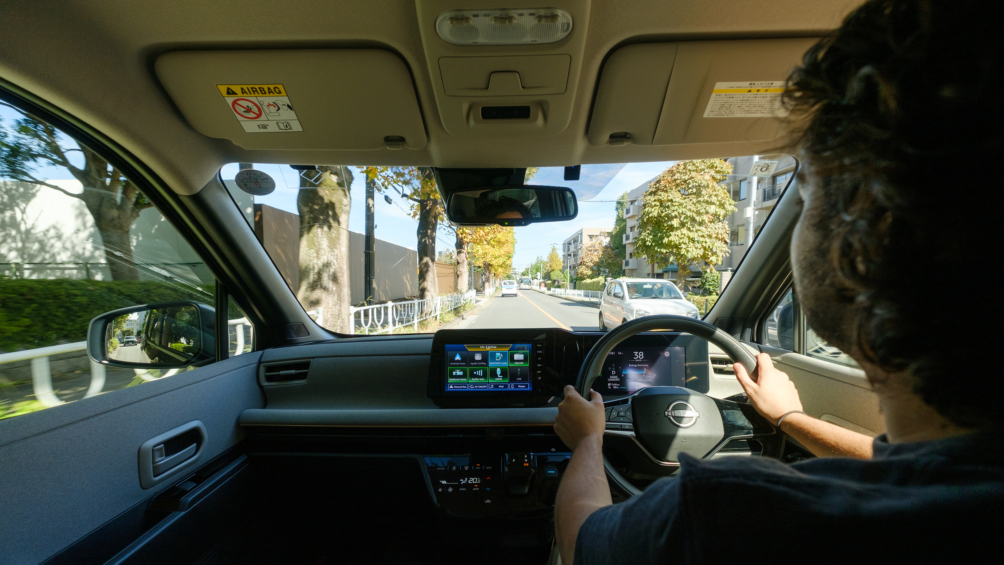 Nissan Sakura - front interior, car being driven by Auto Express senior staff writer Jordan Katsianis in Japan 