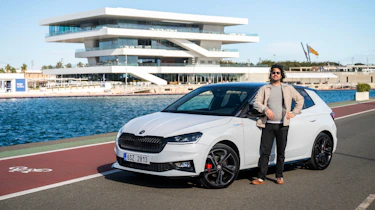 Auto Express senior staff writer Jordan Katsianis standing next to the Skoda Fabia 130