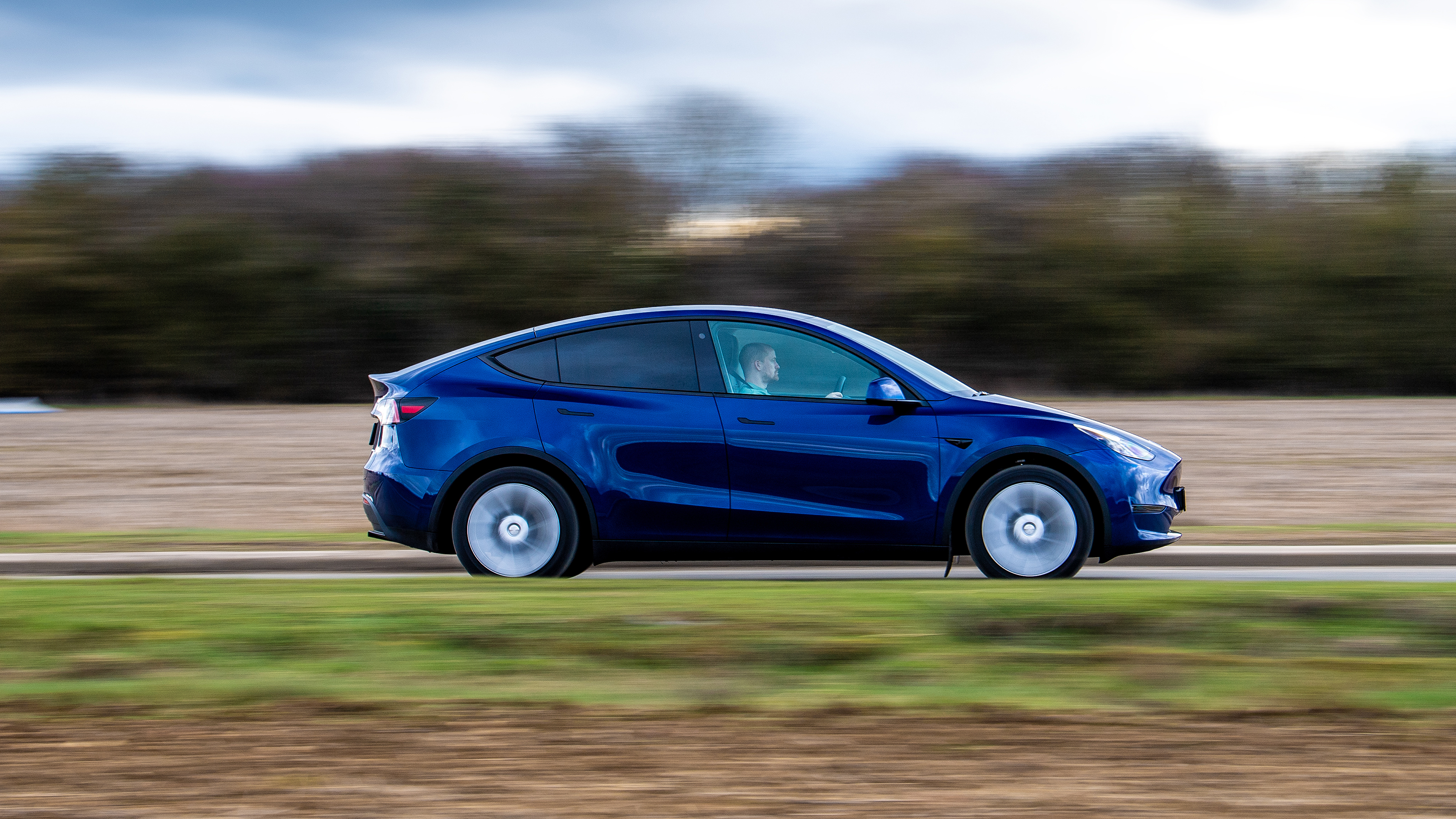 Used Tesla Model Y - side action 