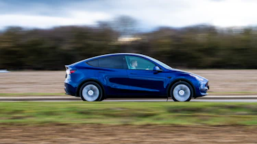 Used Tesla Model Y - side action