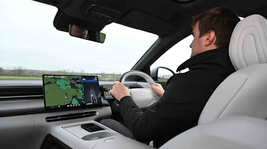XPeng G6 - interior driving shot with Senior news reporter, Alastair Crooks
