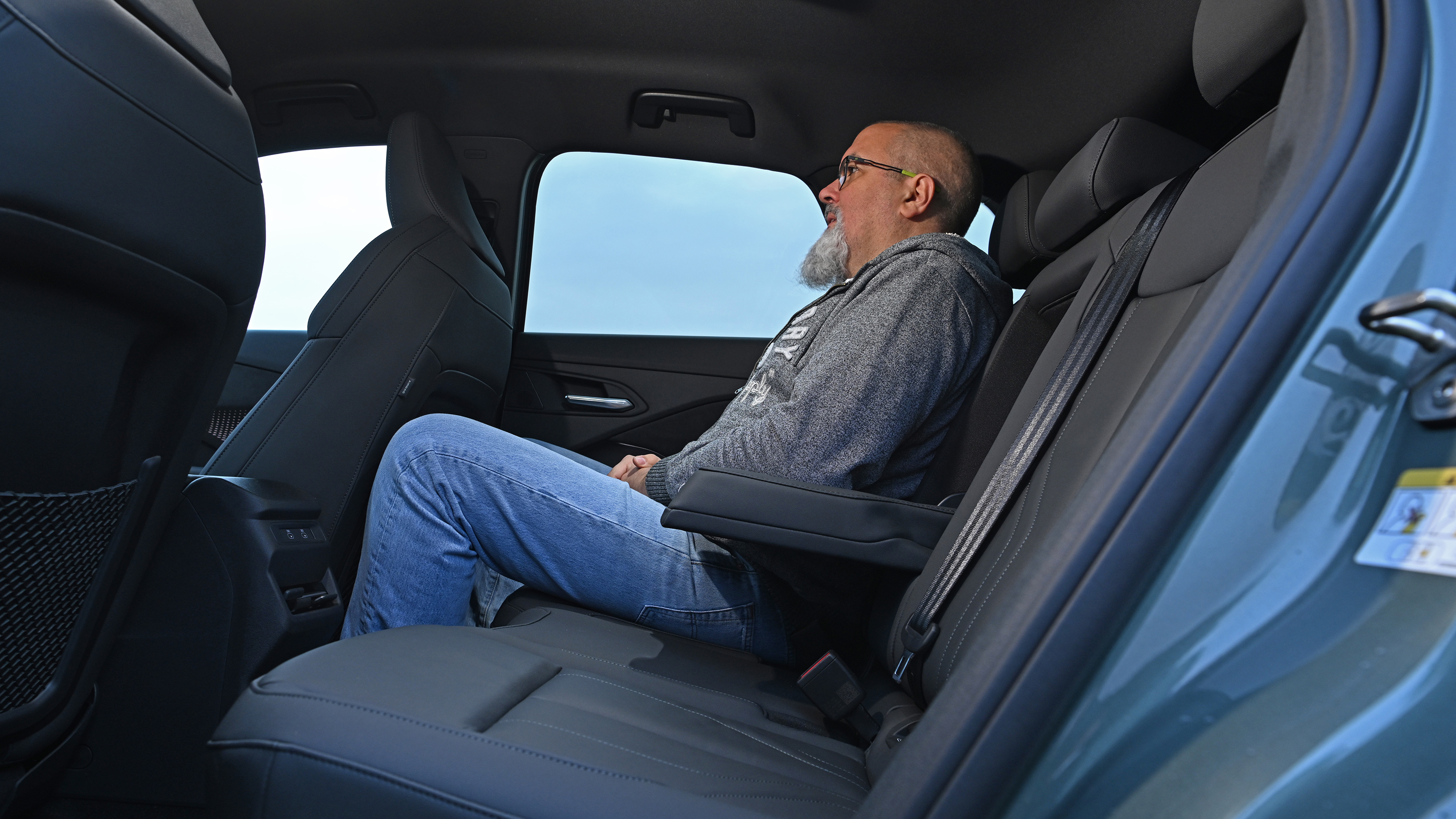Auto Express senior road test editor Dean Gibson sitting in the Audi Q3's rear seat
