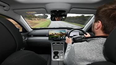 Auto Express senior news reporter Alastair Crooks driving the Chery Tiggo 8