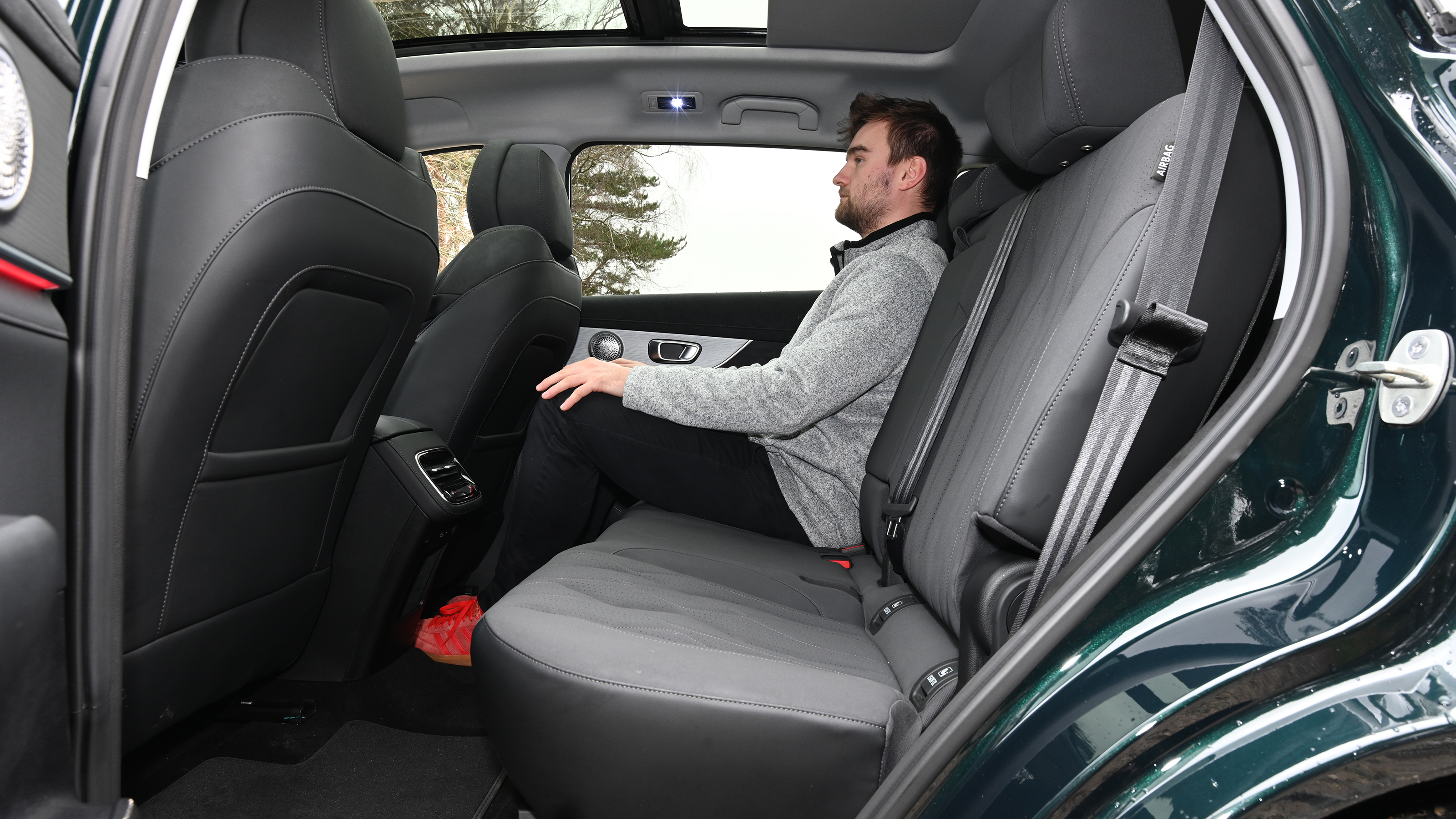 Auto Express senior news reporter Alastair Crooks sitting in the Chery Tiggo 8's mid-row seat