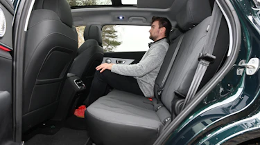 Auto Express senior news reporter Alastair Crooks sitting in the Chery Tiggo 8's mid-row seat