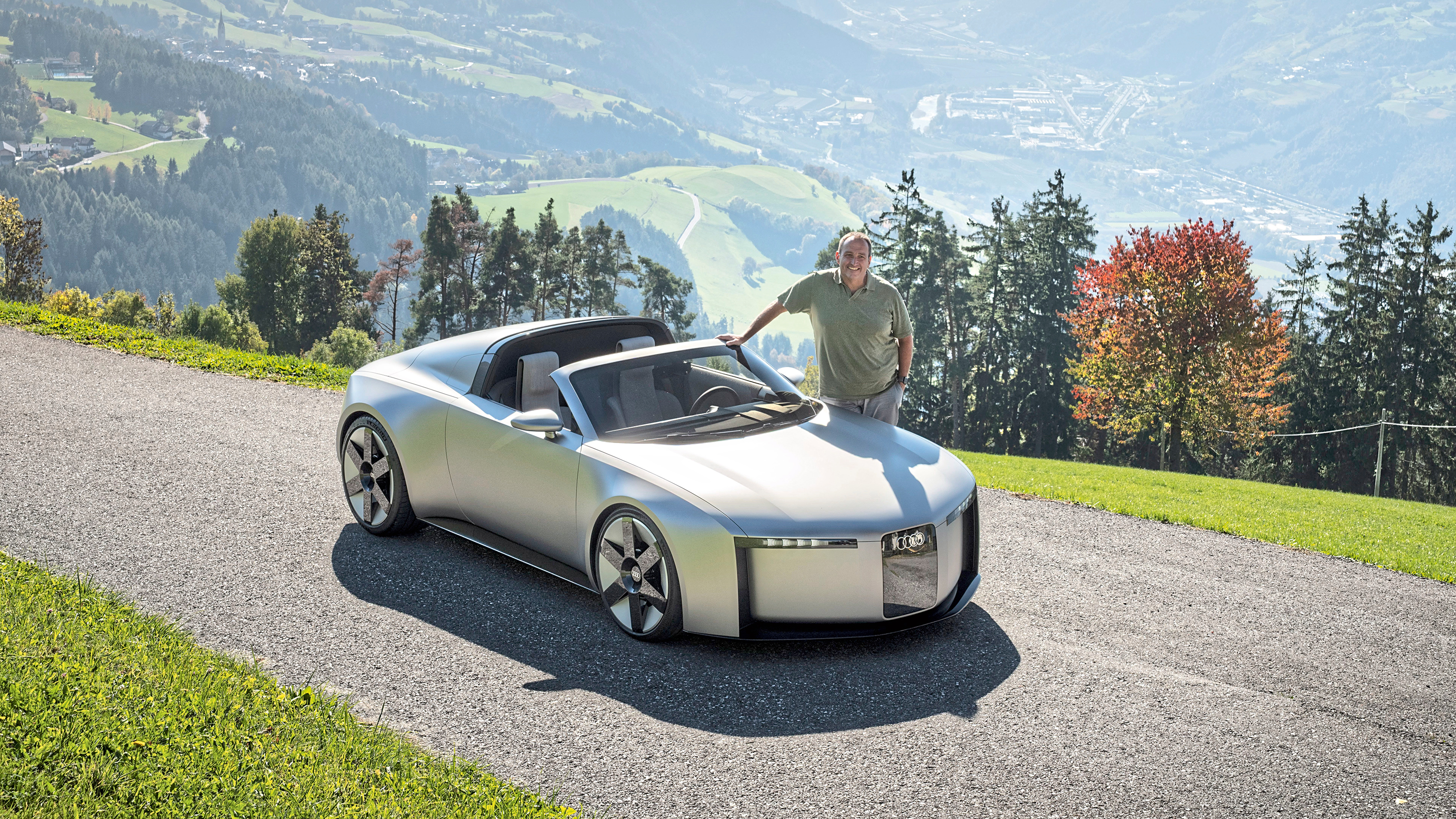 Thomas Geiger standing next to the Audi Concept C