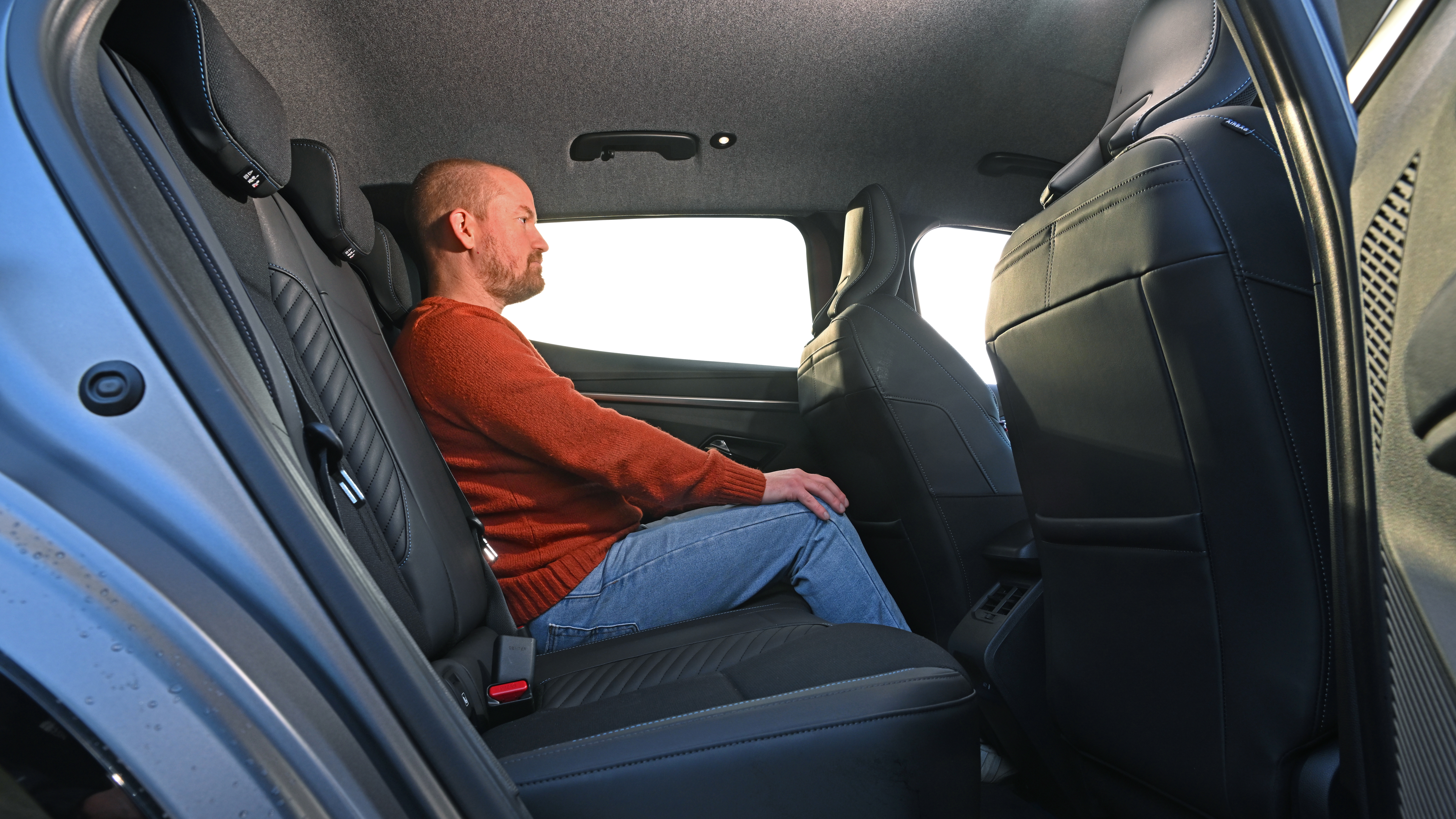 Renault Megane - rear seats being sat in by former Auto Express chief reviewer, Alex Ingram 