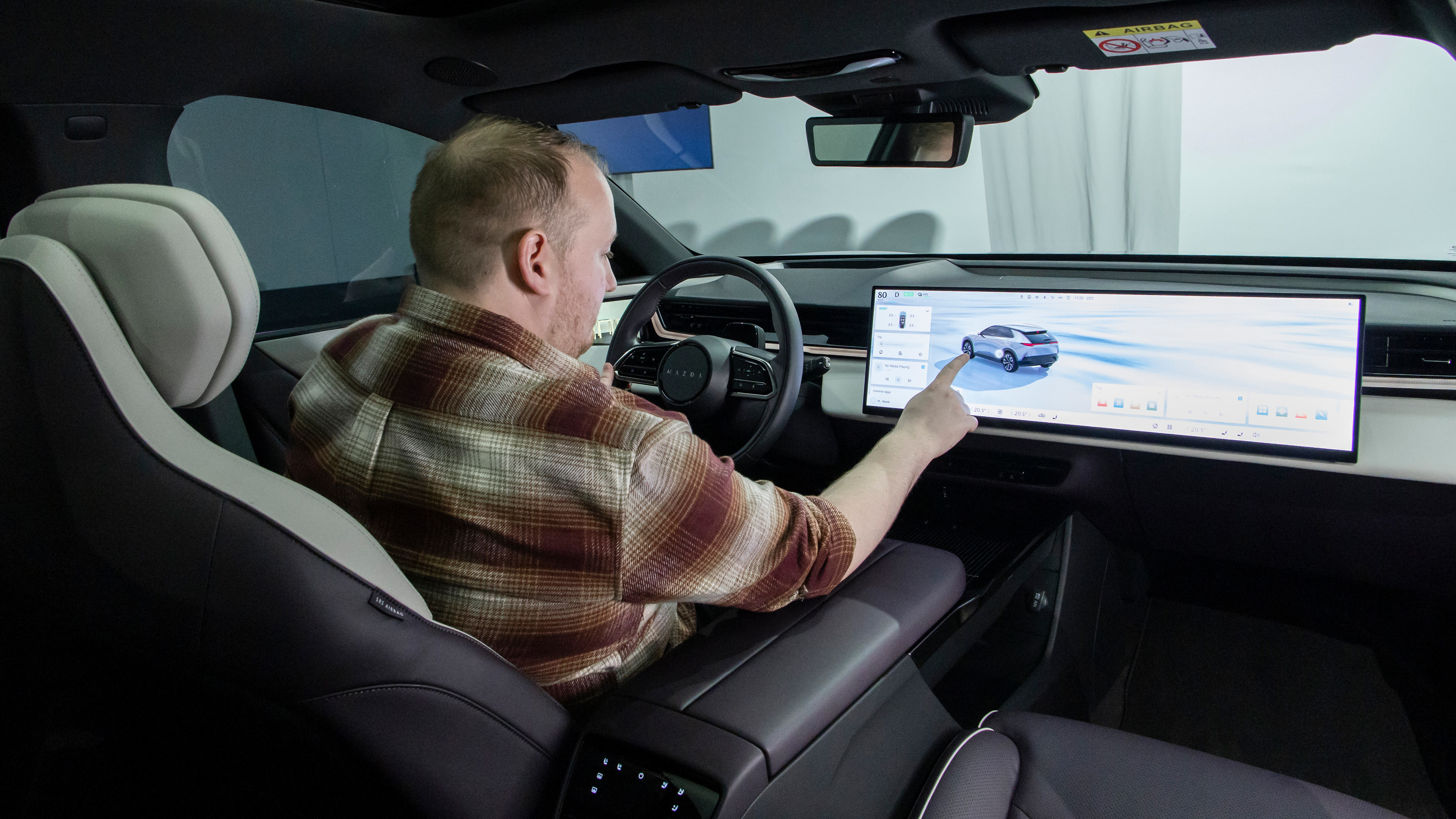Ellis Hyde sat in the Mazda CX-6e