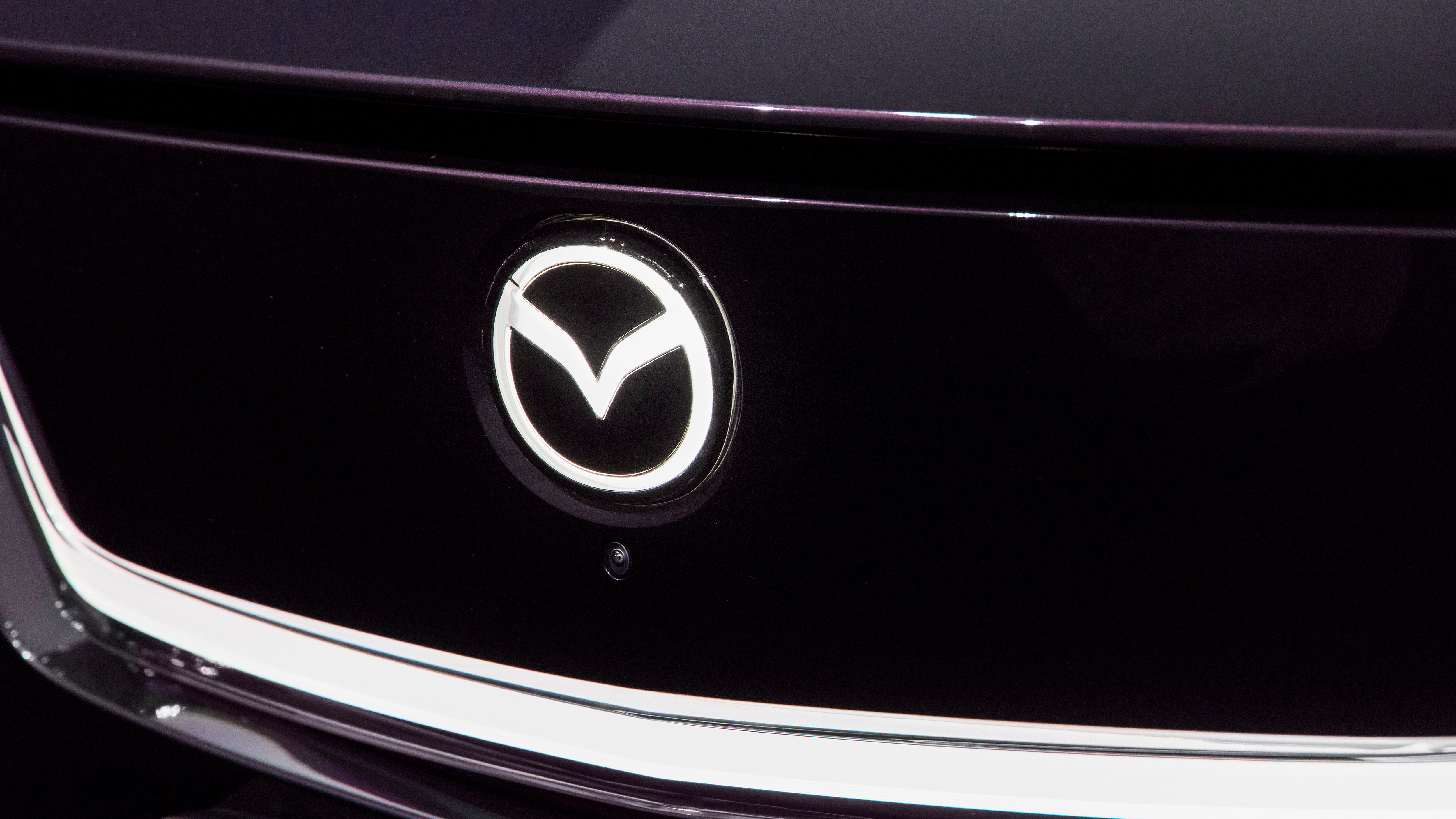 Mazda CX-6e - Mazda badge