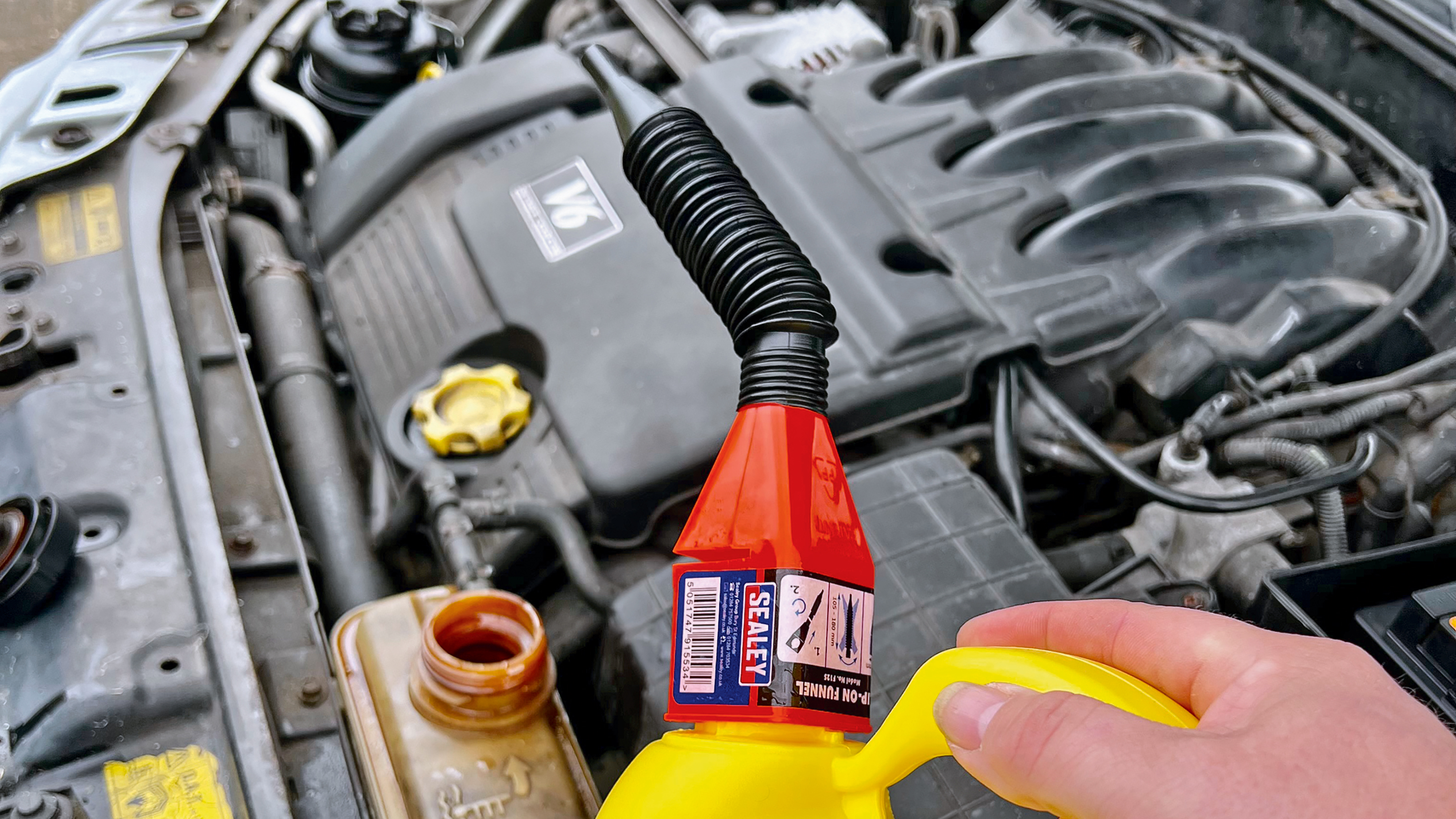 Sealey F12 Clip-On Funnel in use