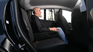 Auto Express senior road test editor Dean Gibson sitting in the Tesla Model Y's rear seat