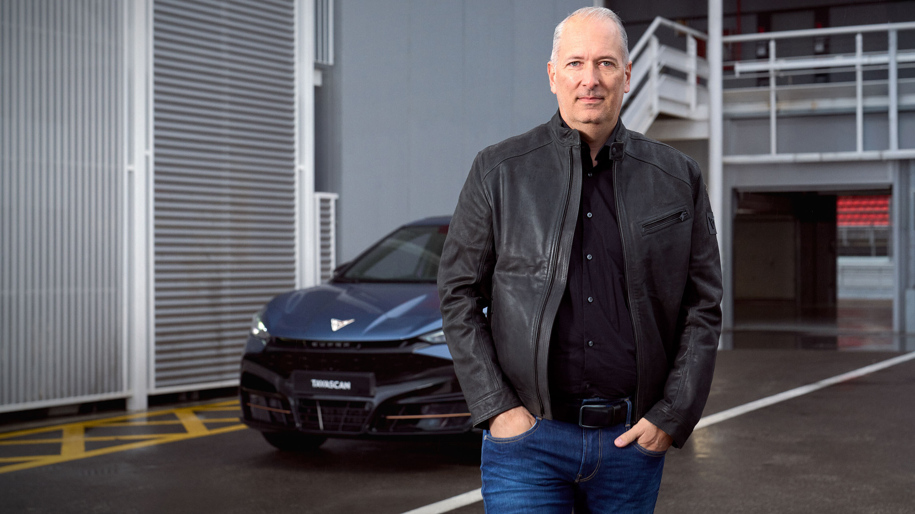 Cupra CEO Markus Haupt standing in front of a car
