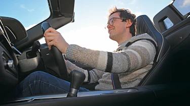 Auto Express consumer reporter Tom Jervis driving a BMW Z4