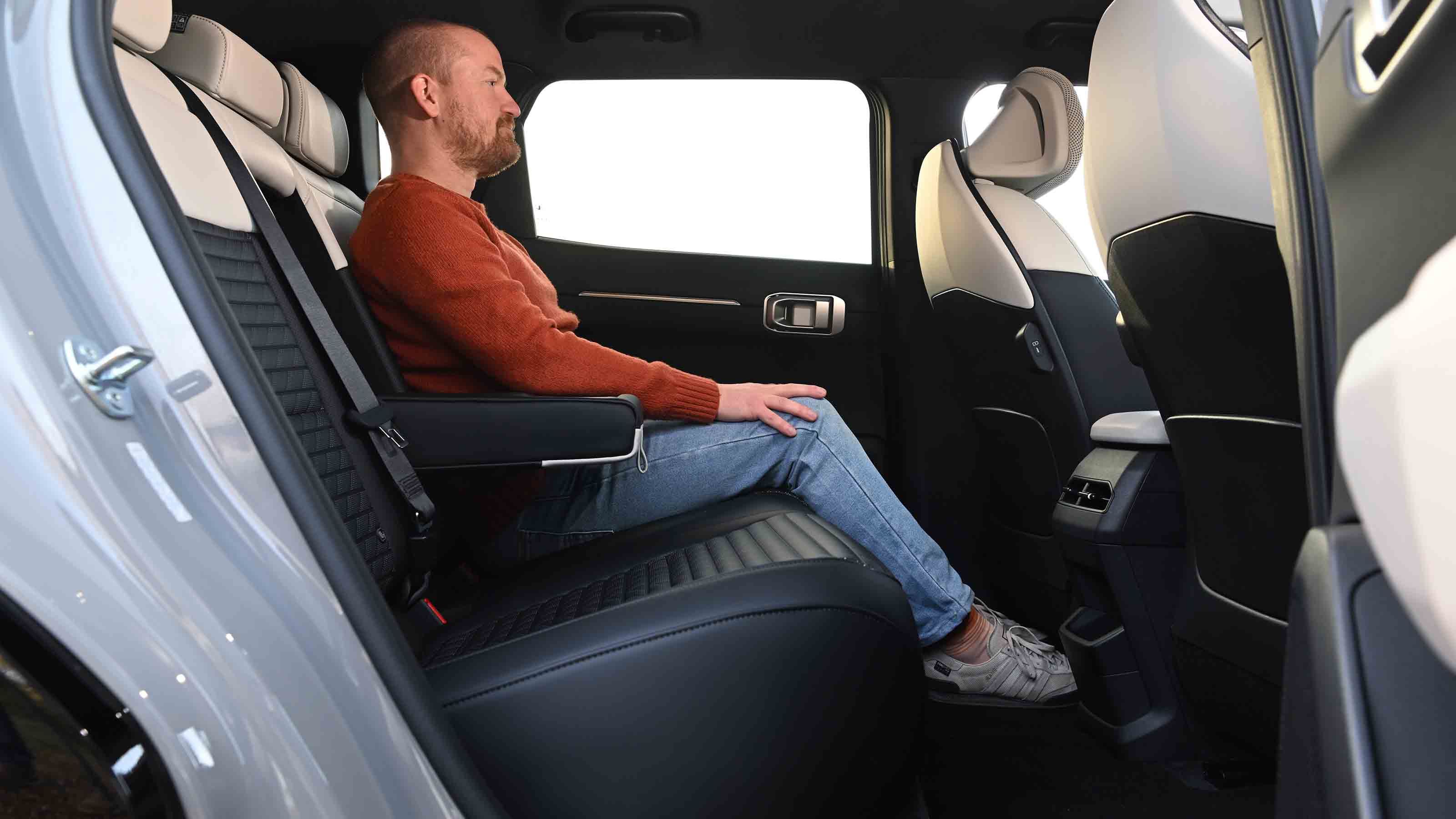 Kia EV4 - rear seats with former chief reviewer, Alex Ingram