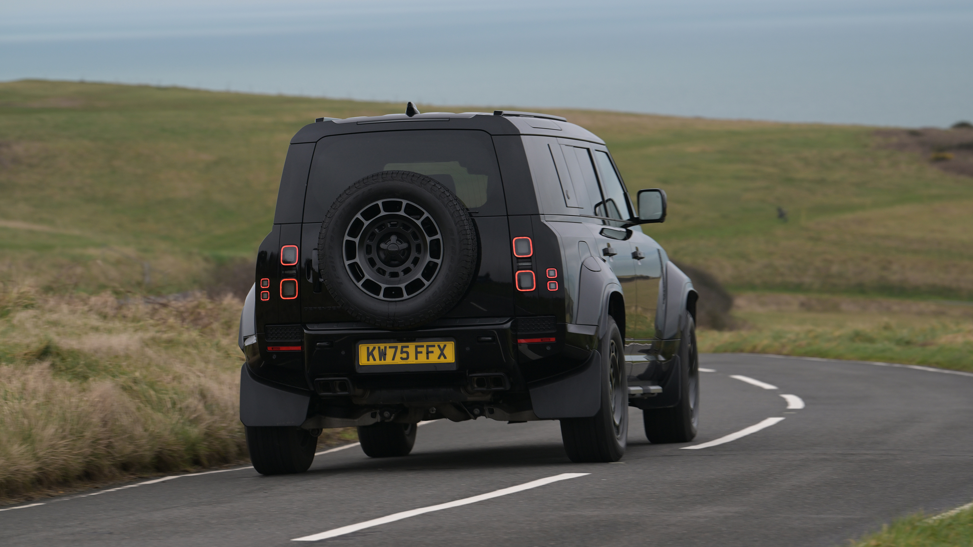 Land Rover Defender OCTA Black - rear cornering (dry)