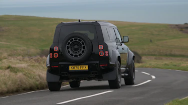 Land Rover Defender OCTA Black - rear cornering (dry)