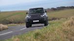 Land Rover Defender OCTA Black - front cornering (dry)