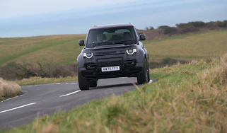 Land Rover Defender OCTA Black - front cornering (dry)