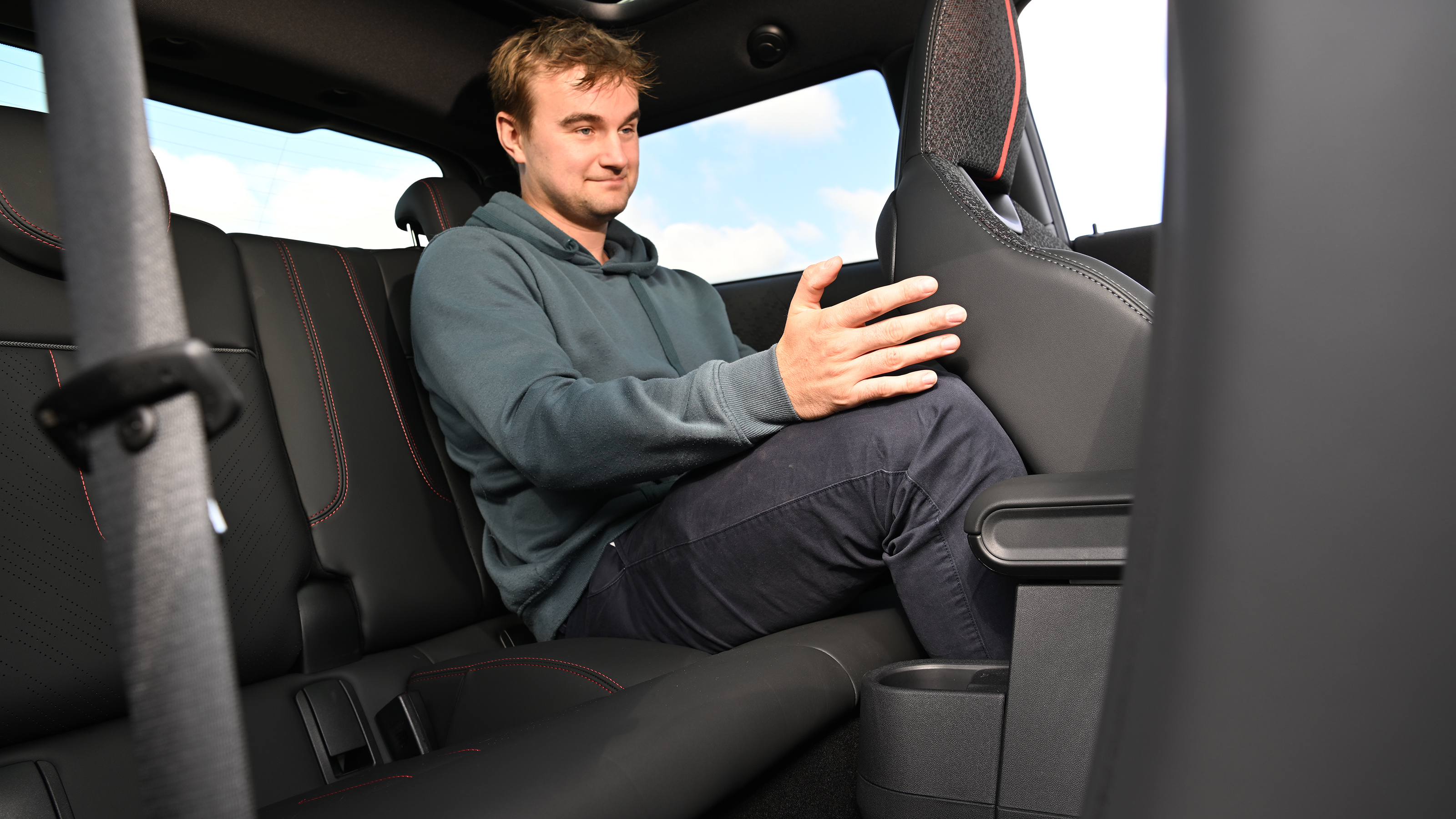 Auto Express senior news reporter Alastair Crooks sitting in the MINI Cooper JCW's rear seat