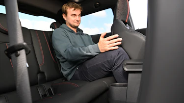 Auto Express senior news reporter Alastair Crooks sitting in the MINI Cooper JCW's rear seat