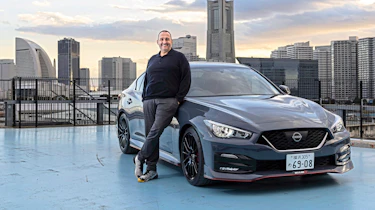 Thomas Geiger standing next to the Nissan Skyline Nismo