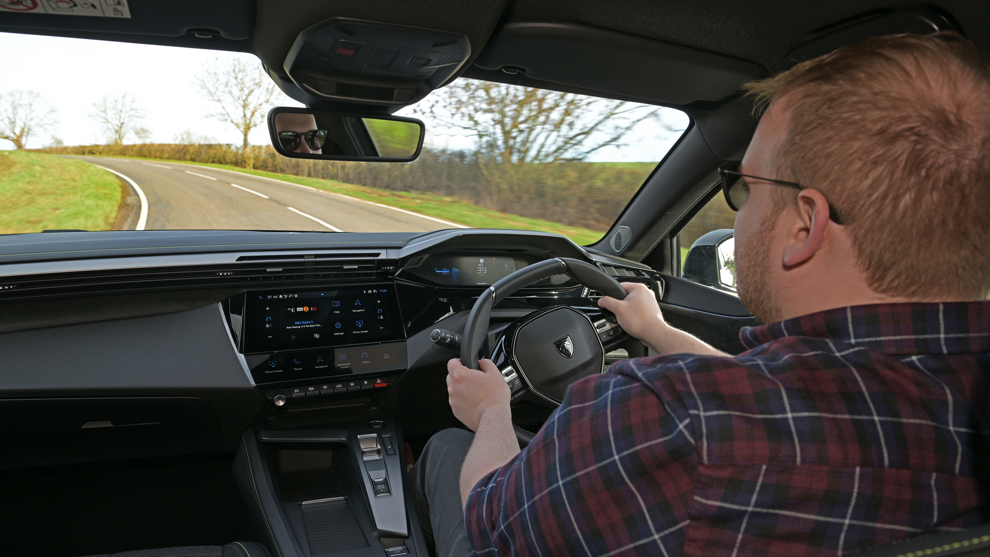 Peugeot E-308 SW facelift - interior, car being driven by Auto Express news reporter Ellis Hyde