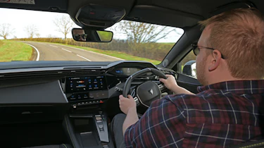 Peugeot E-308 SW facelift - interior, car being driven by Auto Express news reporter Ellis Hyde
