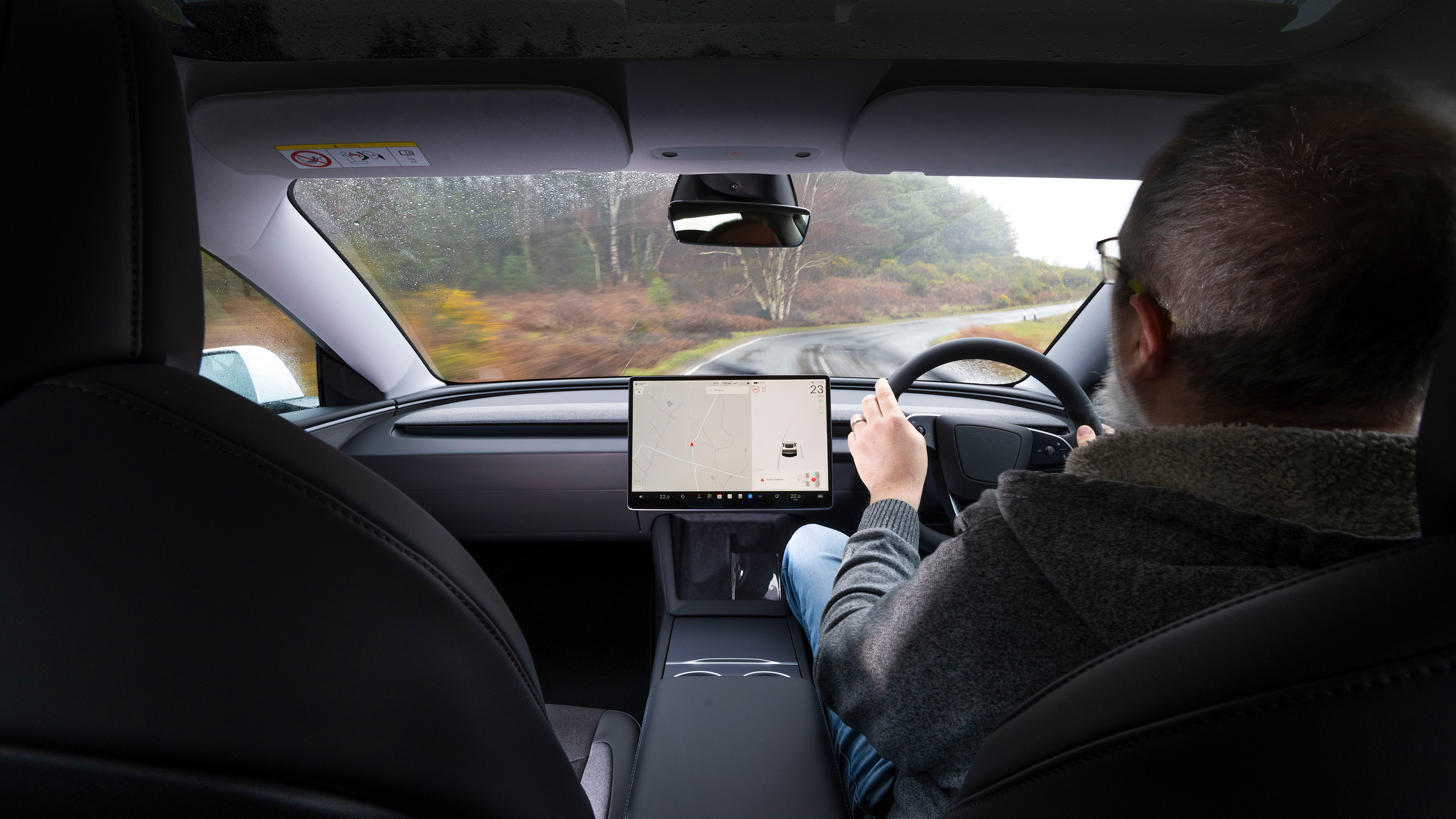 Auto Express senior test editor Dean Gibson driving the Tesla Model 3 RWD