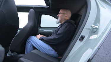 Toyota Aygo X testing in the UK - rear seats being sat in by Auto Express senior test editor Dean Gibson