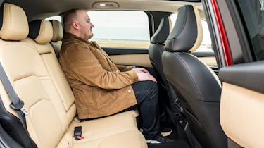 Auto Express news reporter Ellis Hyde sitting in the Mazda CX-5's rear seat