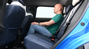 Former Auto Express chief reviewer Alex Ingram sitting in the Alpine A290's rear seat