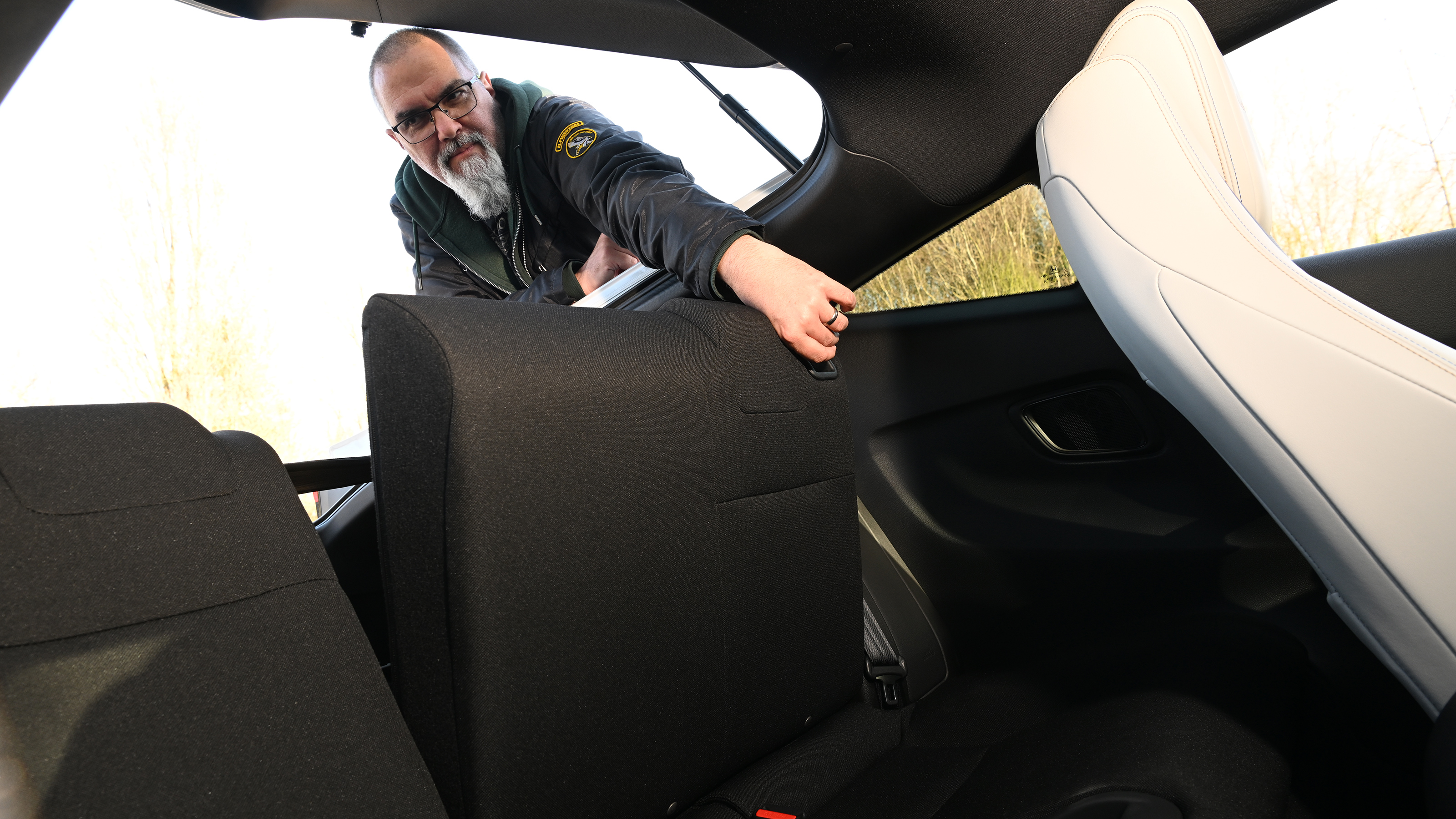 Auto Express senior test editor Dean Gibson folding the Honda Prelude's rear seats