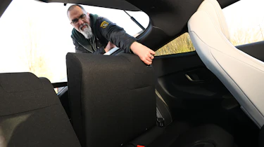 Auto Express senior test editor Dean Gibson folding the Honda Prelude's rear seats