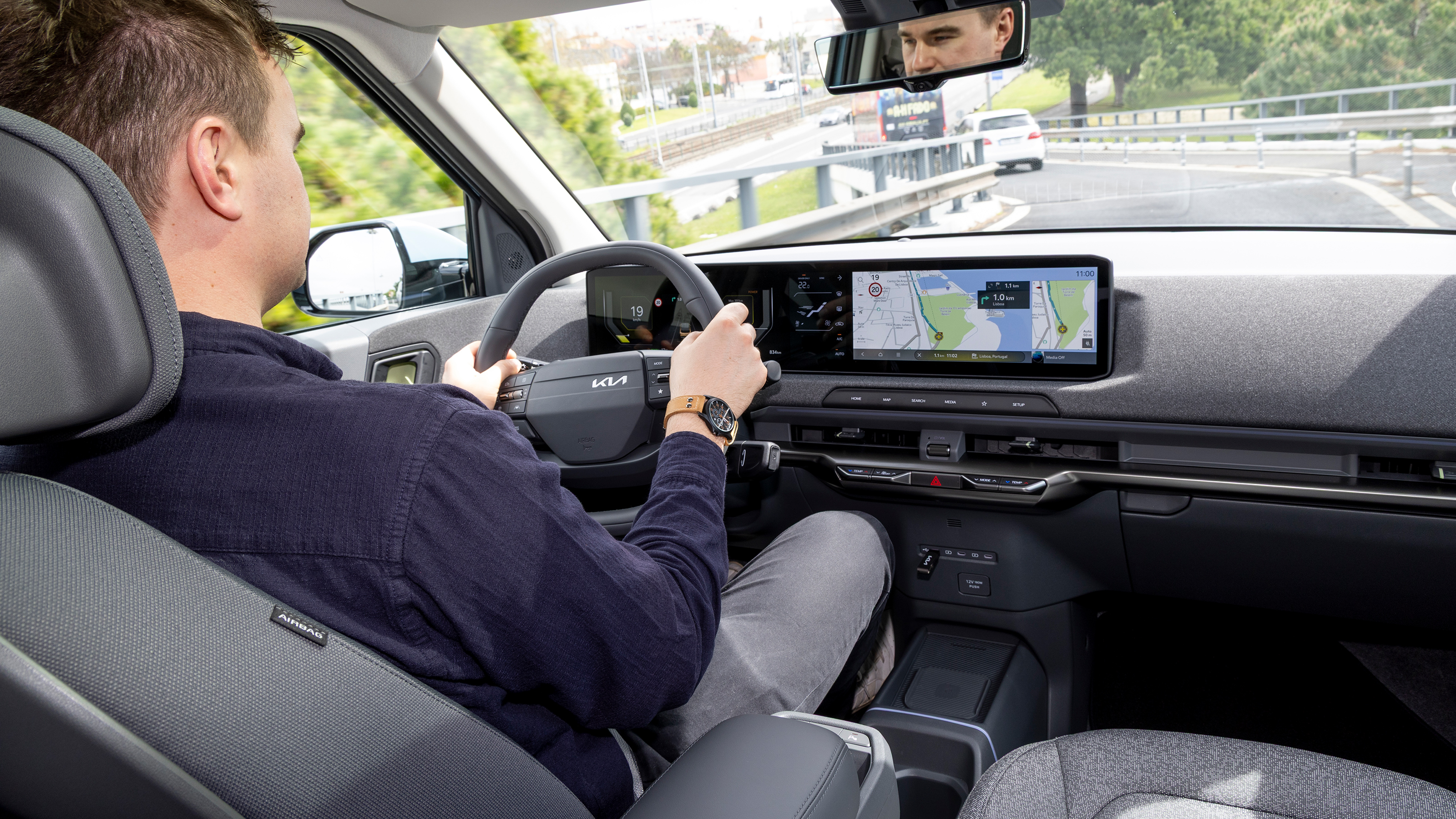 Alastair Crooks driving in the Kia EV2