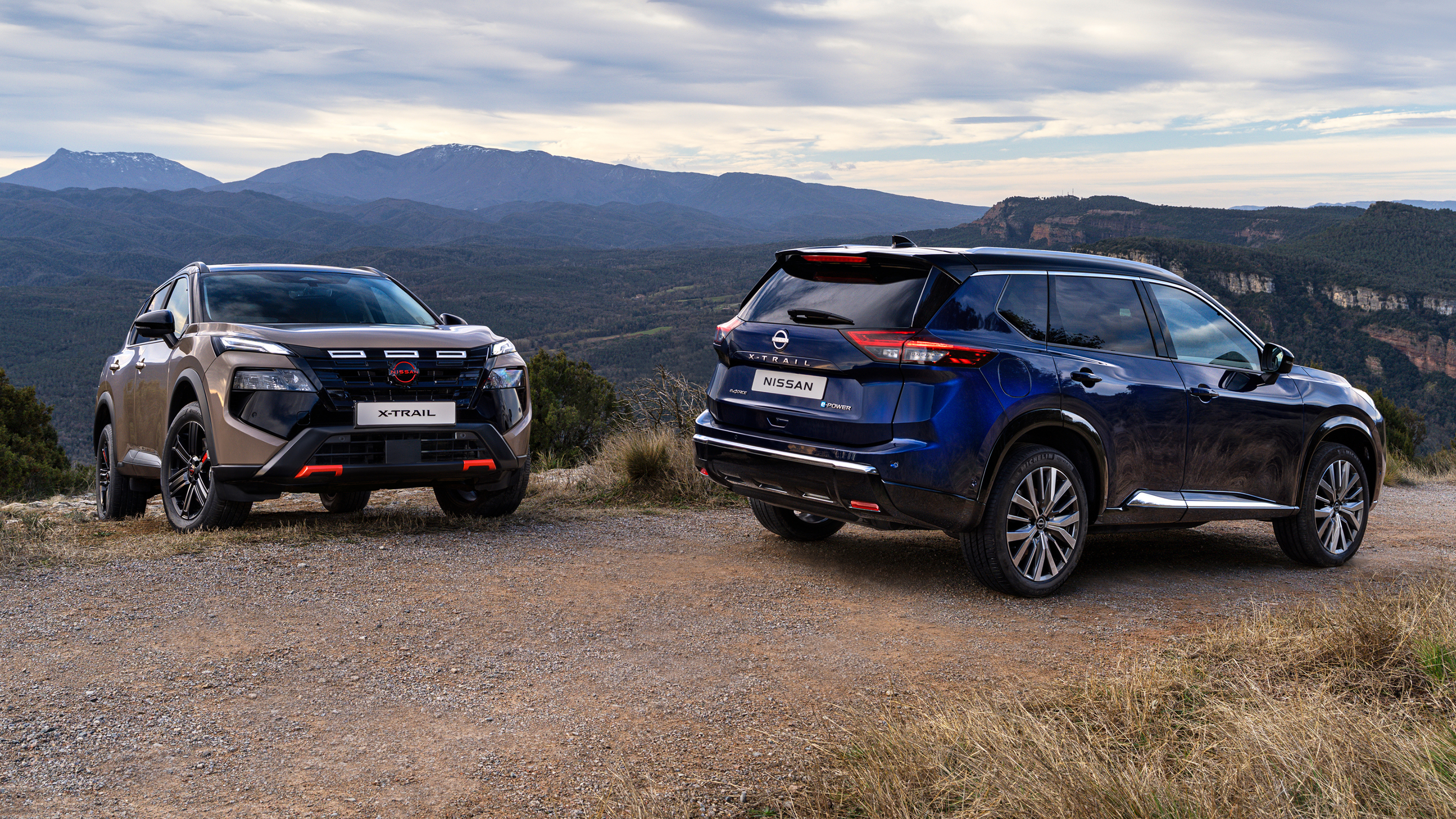 New Nissan X-Trail N-Trek - blue and beige front and rear angled