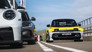 Renault 5 Turbo 3E passing a Porsche 911