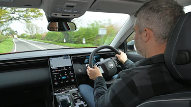 Auto Express deputy editor Richard Ingram driving the Citroen e-C5 Aircross