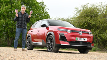Auto Express deputy editor Richard Ingram standing next to the Citroen e-C5 Aircross