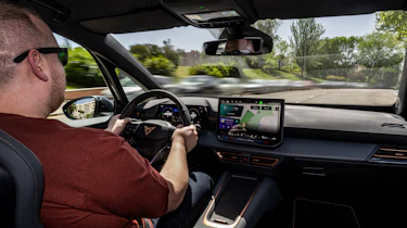 Cupra Born facelift - front interior, car being driven in Spain by Auto Express news reporter Ellis Hyde