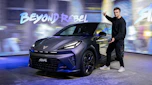 Auto Express senior news reporter Alastair Crooks standing next to a Cupra Raval