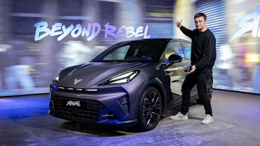 Auto Express senior news reporter Alastair Crooks standing next to a Cupra Raval